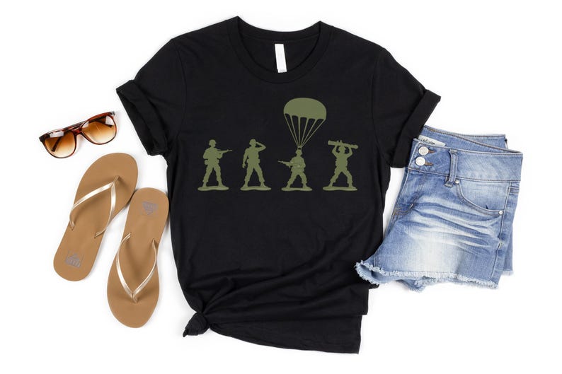 a casual outfit consisting of a black t-shirt with a graphic design, a pair of denim shorts, and a pair of flip-flops.