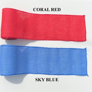 May include: Two rolls of burlap ribbon are displayed. The top roll is coral red, with the text "CORAL RED" above it. The bottom roll is sky blue, with the text "SKY BLUE" below it. The ribbon is likely used for crafts and decorations.
