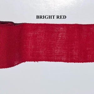 A BRIGHT RED BURLAP ROLL