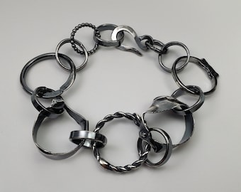 unusual link bracelet made of blackened silver, wearable art, hand-forged unique bracelet