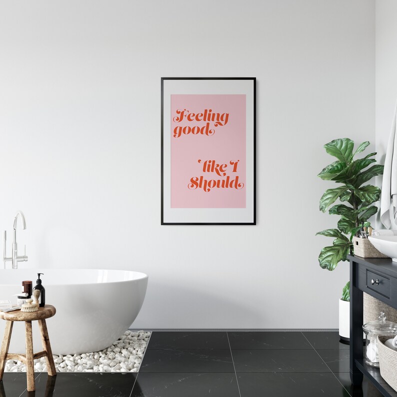 Puede incluir: Una impresi&oacute;n enmarcada rosa y roja con el texto "Feeling good, like I should."