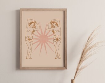 Peut inclure: Une impression encadrée avec un fond rose et deux dessins au trait bruns de femmes avec les bras levés au-dessus de la tête. Les femmes se font face et sont entourées d'un motif en forme d'étoile.