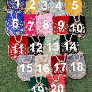 May include: Twenty drawstring bags with pearl embellishments and gold embroidery. The bags are in various colors, including blue, yellow, pink, red, green, and white.