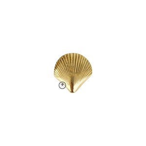 May include: A gold-colored metal seashell wall hook.