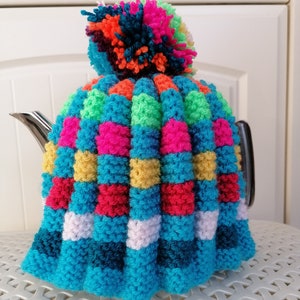 Hand made small traditional knitted tea cosy in Rainbow Colours for 2 cup tea pot