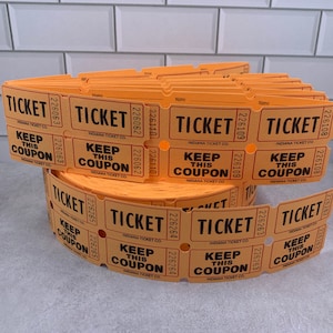 May include: A roll of orange paper tickets with the text "TICKET" and "KEEP THIS COUPON" printed on them. The tickets are from the Indiana Ticket Co.