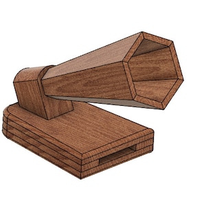 May include: A wooden toy cannon with a hexagonal barrel and a rectangular base. The cannon is made of brown wood and has a simple design.