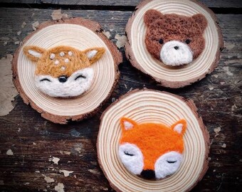 Woodland needle felt log slice decorations for rustic home and nursery décor.