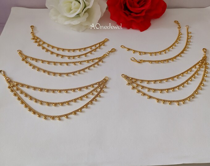 A Pair of Gold Finished Three Layered Kundan Pearl Jhumka Ear Chain ...