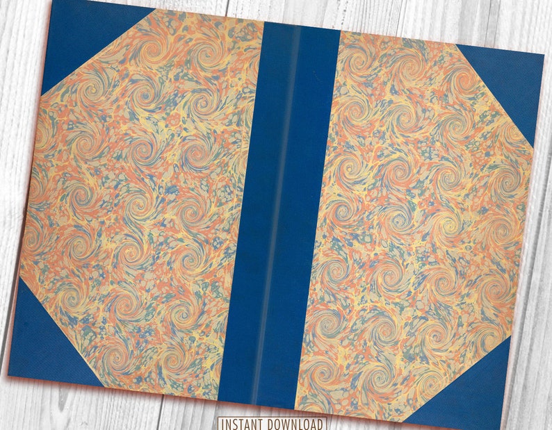 May include: A book with a blue cover and marbled paper pages. The marbling is in shades of orange, yellow, and blue.