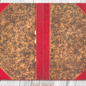May include: A vintage book with a brown leather cover and red edges. The cover is worn and has a mottled pattern.