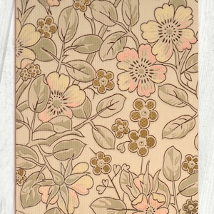 May include: A vintage floral pattern with beige, brown, and pink flowers on a cream background. The pattern is a repeating design of flowers and leaves.