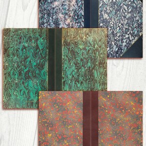 May include: Four vintage book covers with marbled paper designs. The covers are in various colors, including green, blue, and red. Each cover has a spine with a leather binding.