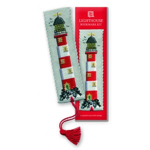 May include: A lighthouse bookmark kit featuring a counted cross stitch design. The bookmark has a red and white striped lighthouse design with a black top and green base. The kit includes a red tassel and the text "LIGHTHOUSE BOOKMARK KIT".