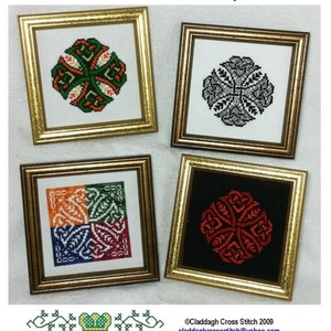May include: Four framed cross stitch designs featuring Celtic knotwork patterns. The designs are in various colours, including green, red, orange, blue, and black. The frames are gold.