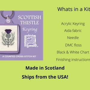 May include: A Scottish Thistle keyring cross stitch kit. The kit includes an acrylic keyring, Aida fabric, needle, DMC floss, a black and white chart, and finishing instructions. The keyring features a counted cross stitch design of a purple thistle.