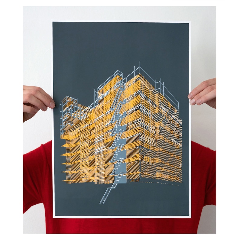 May include: A black and yellow print of a building with scaffolding. The print is on a dark grey background.