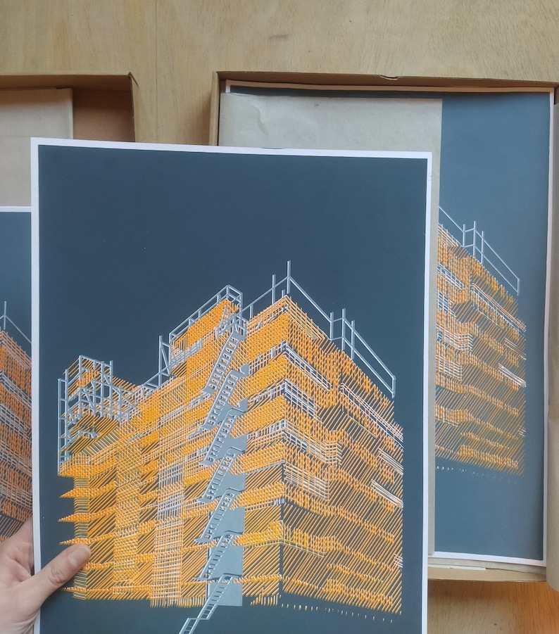 May include: A black and orange print of a building under construction. The building is made of scaffolding and is lit by a bright orange light.
