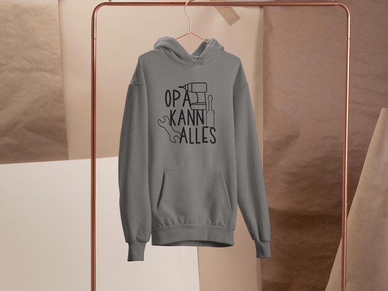 May include: Grey hooded sweatshirt with the text "OPA KANN ALLES" and a drill, wrench, and screwdriver graphic.