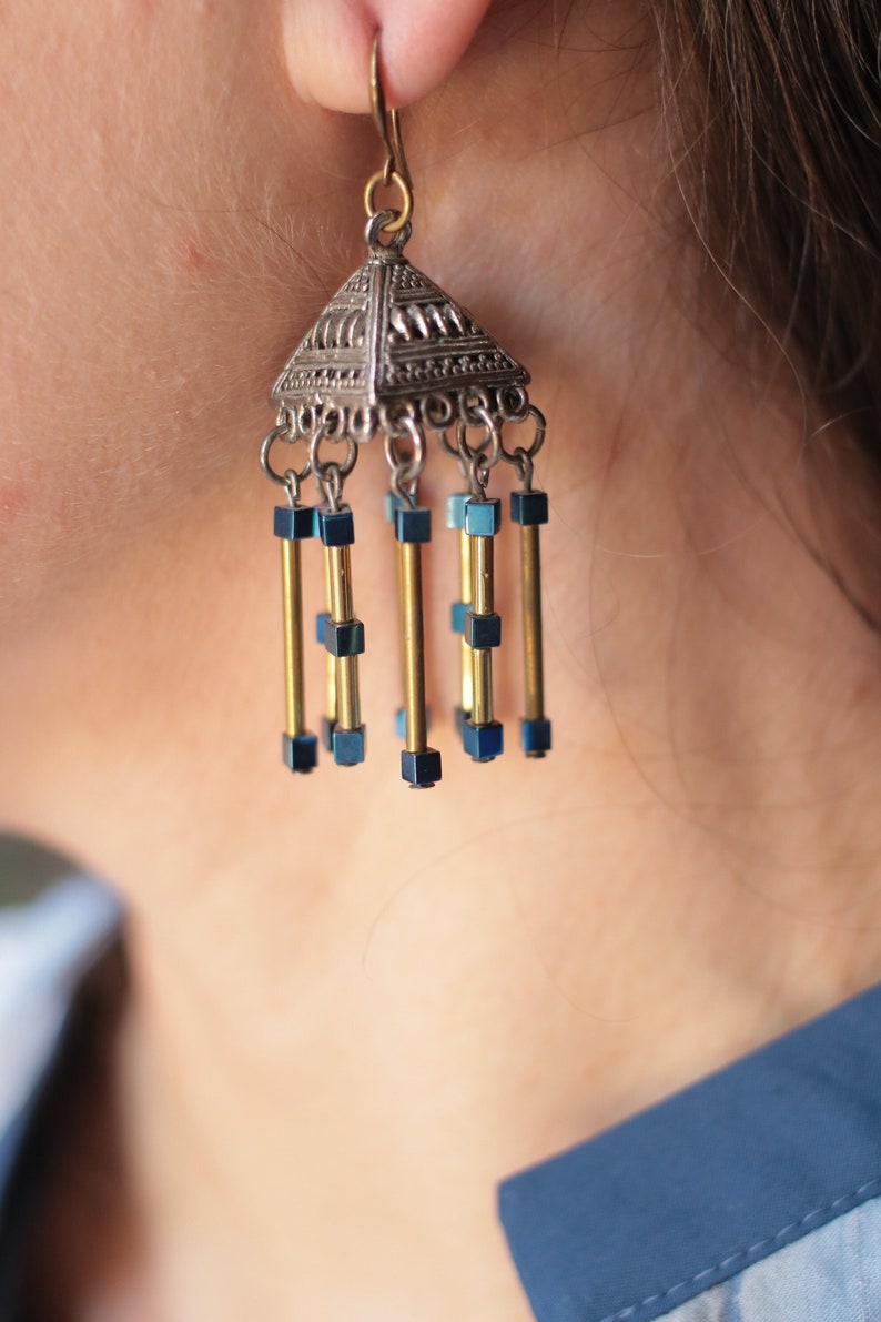 Beautiful earrings in the shape of a triangle cube with silver and gold flowers with blue hematite stones image 1