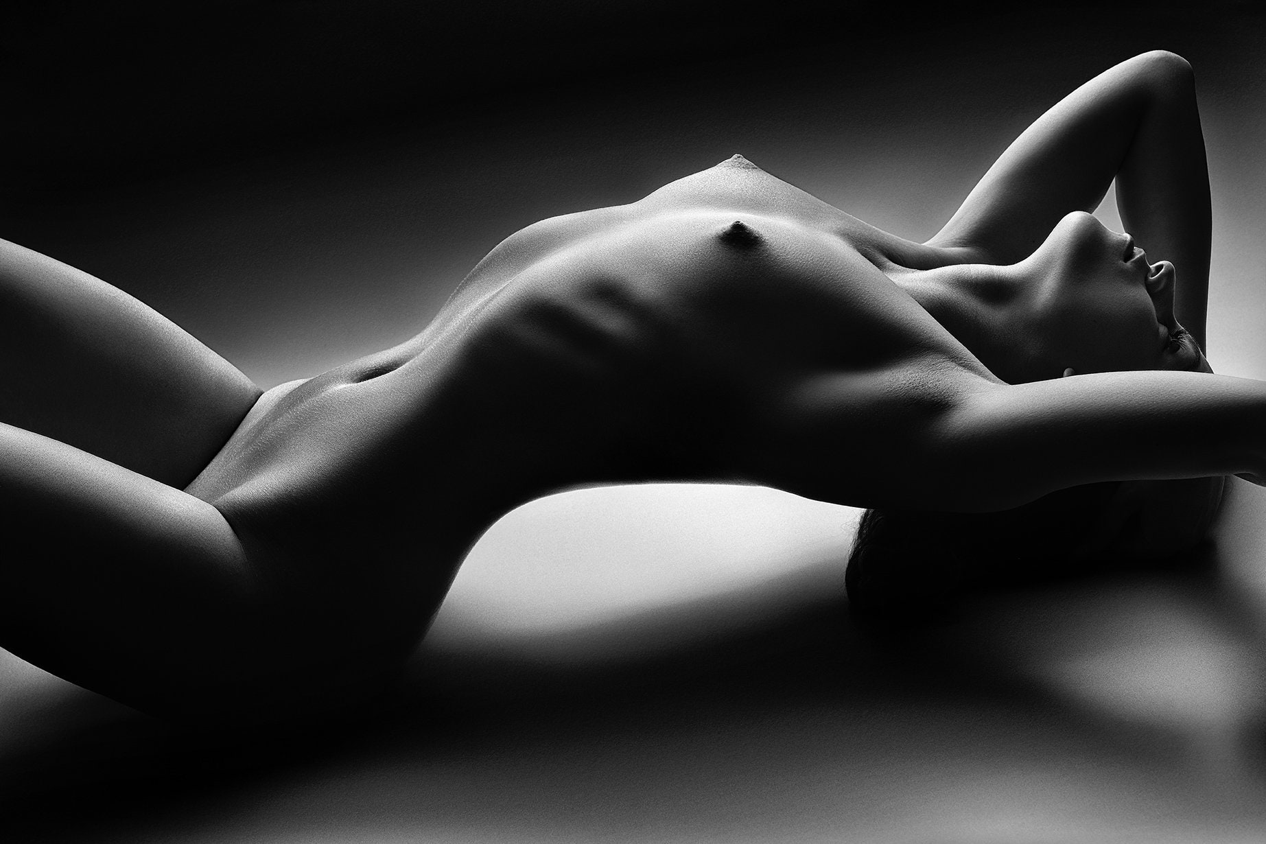 Sensual Nude Woman Lying on the Floor