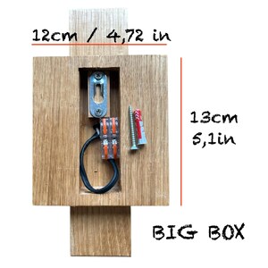 May include: A wooden box with a cutout for electrical wiring. The box is 12 cm by 13 cm and has the words "BIG BOX" written on it.