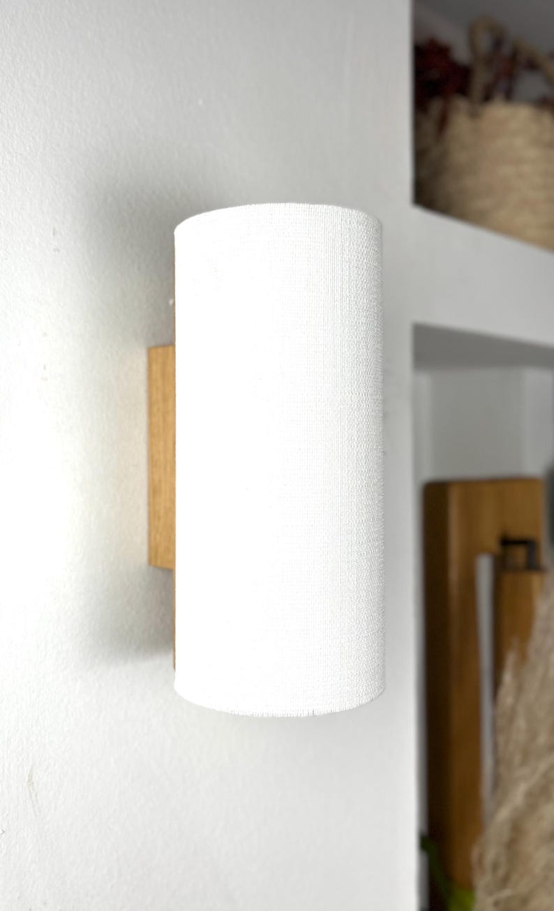 white cylindrical wall lamp