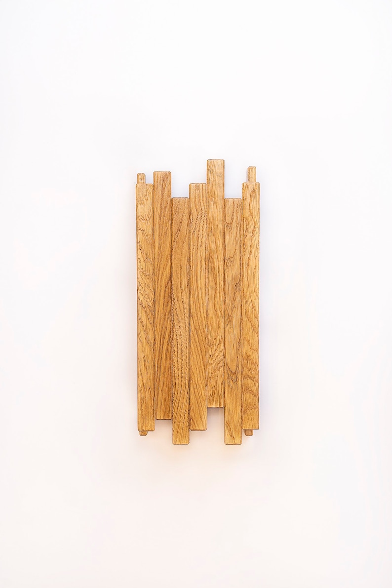 lampara de pared hecha con listones