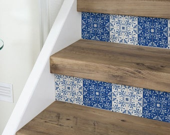 May include: Wooden staircase with decorative blue and white tile risers. The steps are made of light brown wood, and the tiles feature a floral pattern. The staircase is set against a white wall.