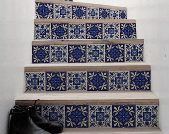 May include: A set of blue and white patterned tile stickers for stairs. The stickers are arranged in a repeating pattern and cover the entire width of each stair tread.