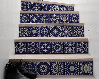 May include: A set of blue and gold patterned tile stickers for stairs. The stickers are arranged in a repeating pattern and cover the entire surface of the stairs. The stickers are a great way to add a touch of style to your home.