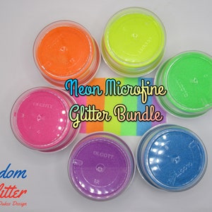 May include: A collection of six small, clear plastic jars filled with vibrant neon glitter in shades of orange, yellow, green, pink, purple, and blue. The jars are arranged in a circular pattern, with the text "Neon Microfine Glitter Bundle" in the center.