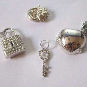 Pendants heart, moon, sun, key in silver