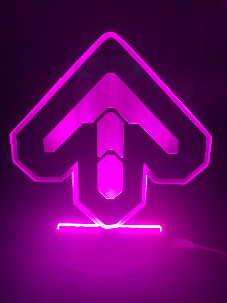 May include: A pink LED light shaped like an upward arrow, with a black outline and a clear acrylic base.