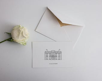 May include: A white rose and a card with a building illustration and the word "GALGORM" are next to a white envelope. The envelope is open, showing a gold interior. The rose has a green stem. The items are on a white surface.