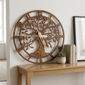May include: A circular wall clock made of dark brown wood featuring a laser-cut tree design with intricate branches and roots. The clock face has cut-out numerals along the outer ring and two thin, light-colored metal hands at the center.