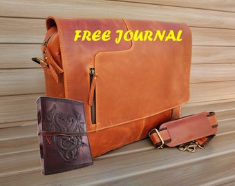 May include: A brown leather messenger bag with a zipped pocket and a matching brown leather strap. The bag comes with a free brown leather journal featuring an embossed design.