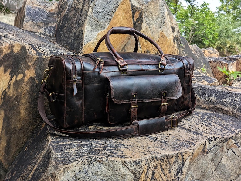 Handmade vintage leather duffle bag with shoulder strap, perfect for travel, gym, or weekend use. Rustic brown full-grain leather bag for men.