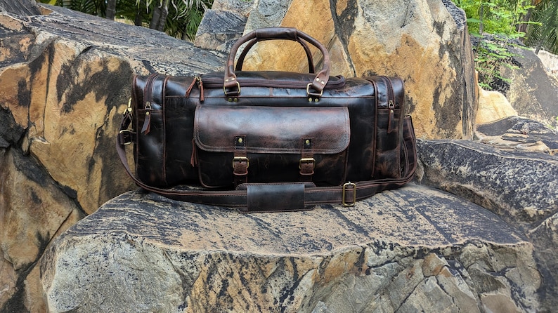 Handmade vintage leather duffle bag with shoulder strap, perfect for travel, gym, or weekend use. Rustic brown full-grain leather bag for men.