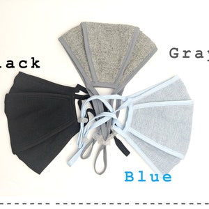 May include: Three face masks in black, gray, and blue. The masks are made of a soft, breathable fabric and have adjustable ear loops.