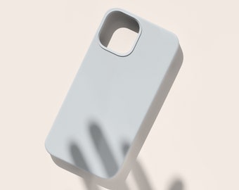 May include: A white phone case with a cutout for the camera lens.