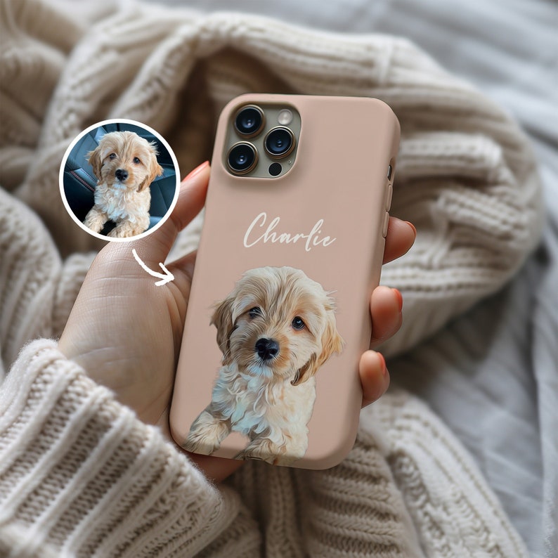 May include: A light brown silicone phone case with a white dog illustration and the name 'Charlie' written in white cursive on the back.