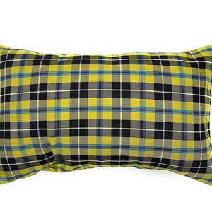 May include: A yellow and black plaid pillow with a rectangular shape.