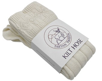 May include: A pair of white knitted kilt hose with a label that reads "Tartan Tweeds Kilt Hose" and a website address.