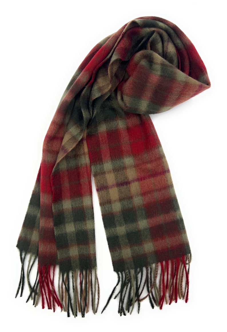 May include: A red and green plaid scarf with fringed ends.
