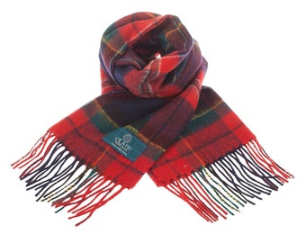 May include: A red, navy, and green plaid scarf with fringed edges. The scarf features a woven pattern and a label with text. The scarf is made of a soft material and is suitable for cold weather.