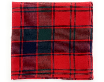 May include: Red, black, and green plaid fabric with a subtle sheen. The fabric has a woven texture and is folded in half.