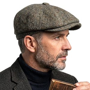May include: A brown and green herringbone tweed newsboy cap. The cap features a rounded crown and a small, stiff peak. The fabric has a textured appearance. A classic style, suitable for various occasions.