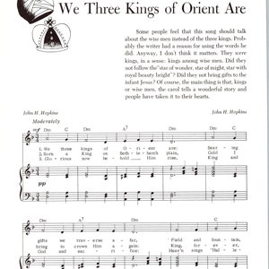 May include: A sheet of music featuring the lyrics and melody for the Christmas carol "We Three Kings of Orient Are". The music is written in a traditional style with notes and clefs. The lyrics are printed in black ink on a white background.