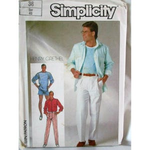 May include: A Simplicity sewing pattern envelope featuring Henry Grethel designs. The cover displays a light blue striped button-down shirt, a solid blue long-sleeve shirt with shorts, and a red long-sleeve shirt with light pink trousers.